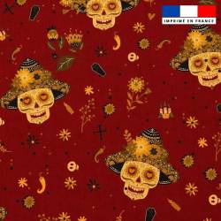 Popeline de coton rouge peigné motif tête de mort mexicaine